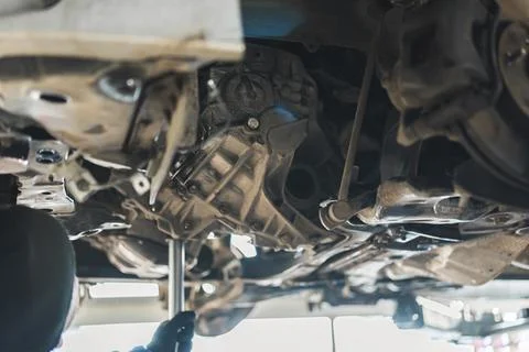 Mechanic replacing a clutch using various tools to remove and install new clutch 스톡 사진