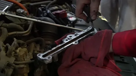 Mechanic Replacing Engine Part | Stock Video | Pond5
