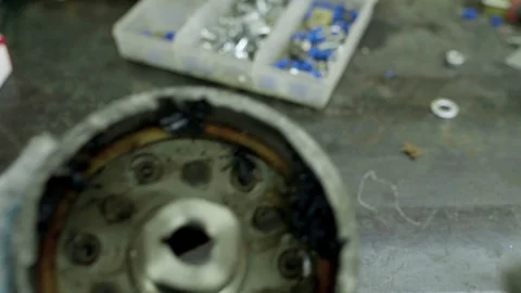 Mechanic rotating broken car ball bearings housing Stock Footage 128921701