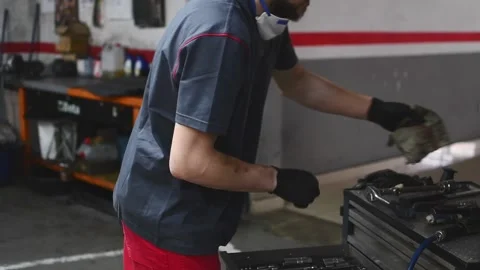 Mechanic selecting and preparing his tools Video stock 132304021