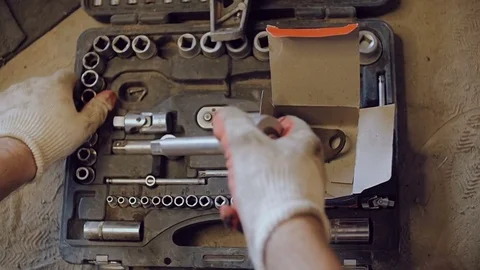The mechanic selects the head for a wrench. Stock Footage 78830395