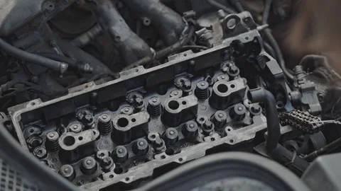 The mechanic is skillfully repairing the engine block in an automotive workshop Video stock 279332297