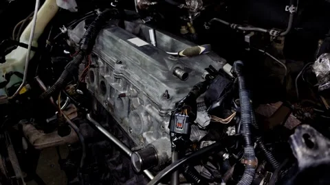Mechanic socket wrench lying on a silver car engine valve cover Stock Footage 340415329