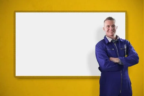 Mechanic standing in front of a white screen on yellow background Stock Illustration