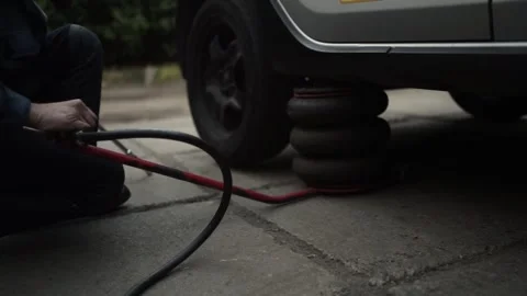 Mechanic Swaps Summer Tires for Winter Tires Video stock 297111153