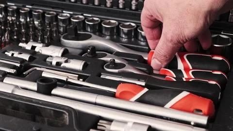 The mechanic takes out a socket wrench from his case. Stock Footage 261958479