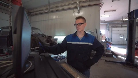 Mechanic talks about the breakdown Stock Footage 100312138