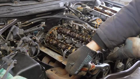 Mechanic tightening valves during engine repair Stock-Footage 297463805