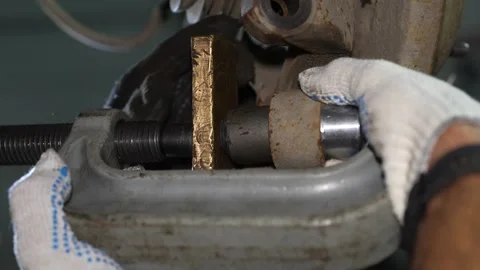 Mechanic tightens screw press tool to press new bush into knuckle. Stock Footage 345908841