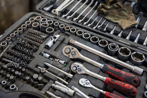 Mechanic tool set with ratchets sockets bits and wrenches in auto repair shop Stock Photos