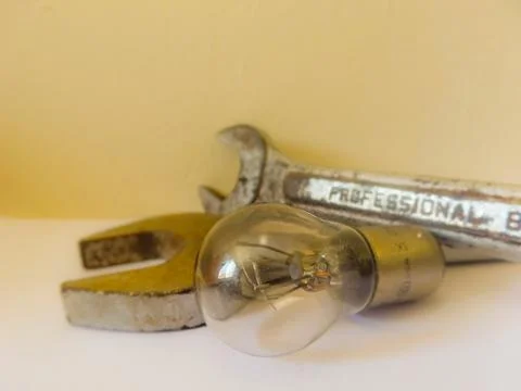 Mechanic Tools: Two old rusty simple wrenches and one lamp off. Taken close u Stock Photos