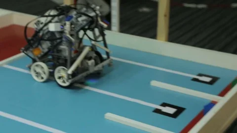 Mechanic Toy Robot Moves and Turns on Platform Stock Footage