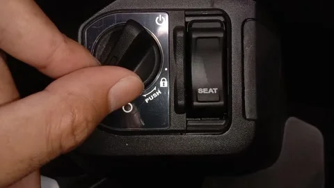 The mechanic is trying to turn on the motor socket Stock Footage 242822354