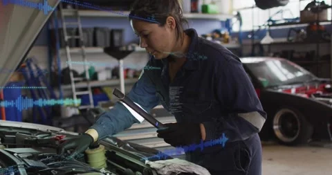 Mechanic turning on work light and probing engine, activating blue diagnostics Stock Footage 329910914