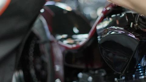 The mechanic is twisting bold in a motorcycle Stock Footage 120608993