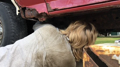 Mechanic Under Rusty Car Works Stock Footage