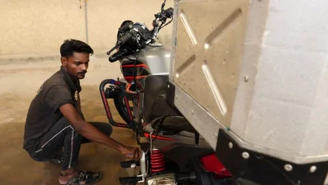 Mechanic Using Brush To Clean Engine On Honda CBF150F. Slow Motion Reveal Video stock 197817366
