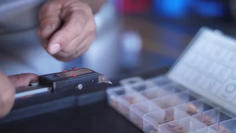 Mechanic using a caliper digital thickness gauge micrometer ruler slow motion Stock Footage