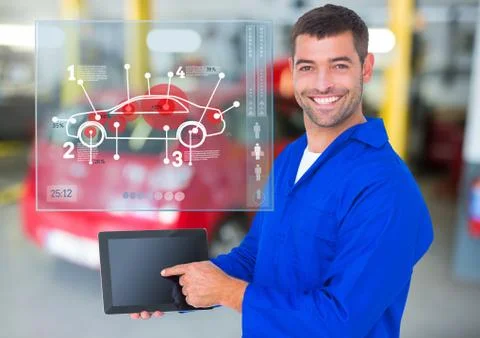 Mechanic using digital tablet against car mechanics interface in background Stock Photos