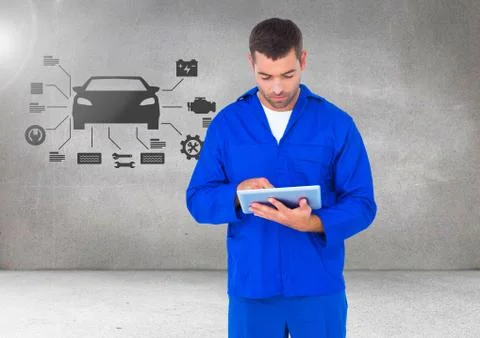 Mechanic using digital tablet against car mechanic interface in background Stock Photos