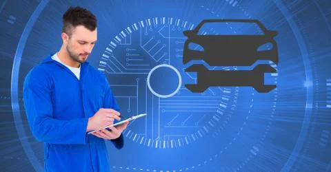 Mechanic using digital tablet against car mechanic interface in background Stock Photos