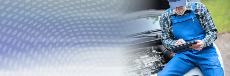Mechanic using digital tablet for checking car engine; panoramic banner Stock Photos