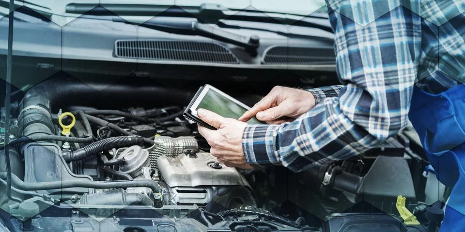 Mechanic using digital tablet for checking car engine, geometric pattern Stock Photos