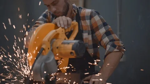 Mechanic using electrical angular grinding machine at factory Stock Footage 93158851
