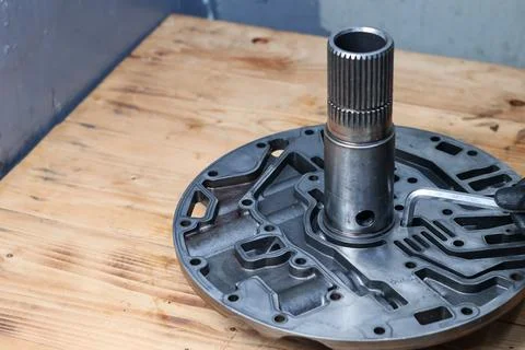 A mechanic using a hex key tool to assemble or service a transmission front.. Stock Photos