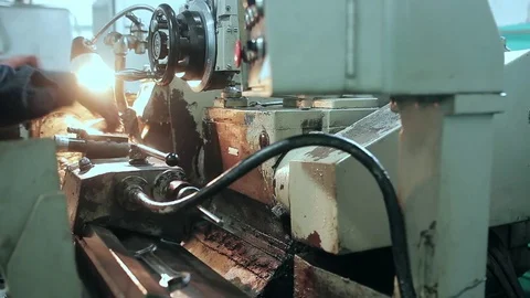 Mechanic using industrial lathe machine Stock Footage 70567052