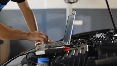 Mechanic Using Laptop for Car Diagnostics Stock Footage 315145086