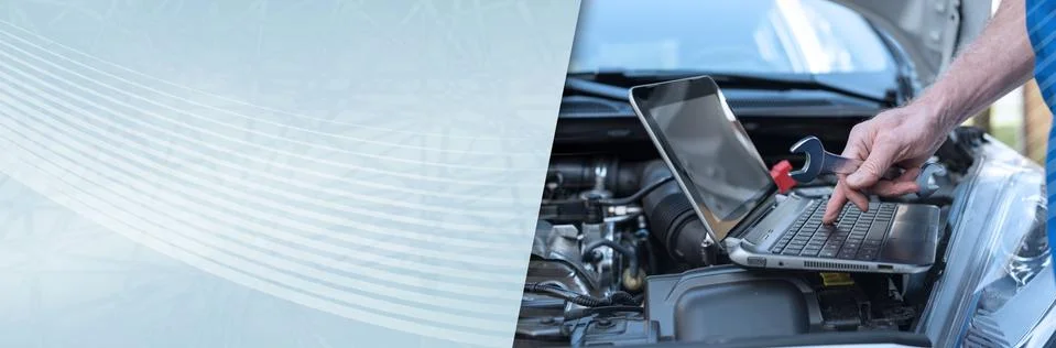 Mechanic using laptop for checking car engine. panoramic banner 写真素材