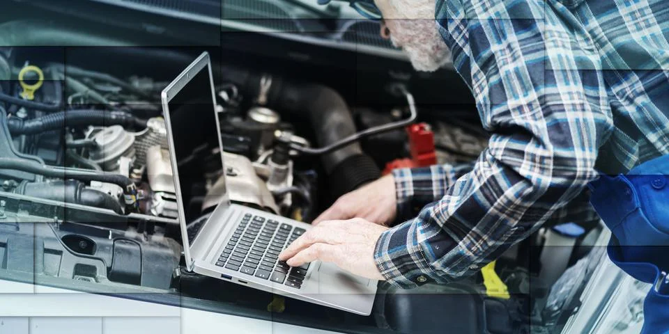 Mechanic using laptop for checking car engine, geometric pattern Stock Photos