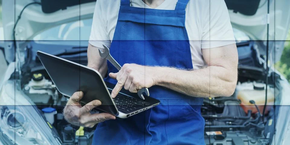 Mechanic using laptop for checking car engine, geometric pattern Stock Photos