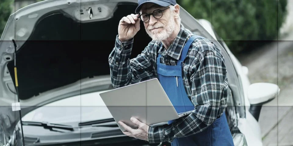 Mechanic using laptop for checking car engine, geometric pattern Stock Photos