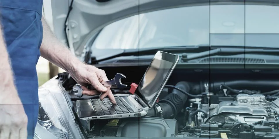 Mechanic using laptop for checking car engine, geometric pattern Stock Photos