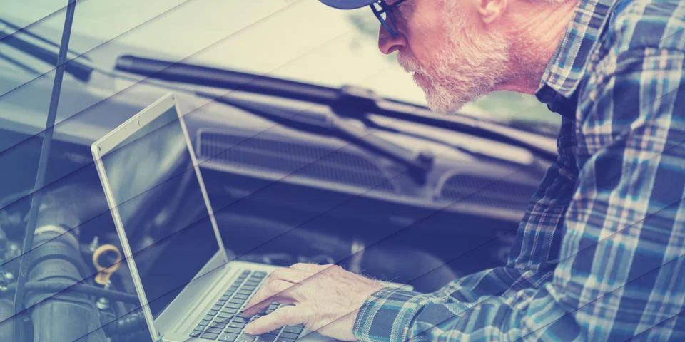 Mechanic using laptop for checking car engine, geometric pattern Stock Photos