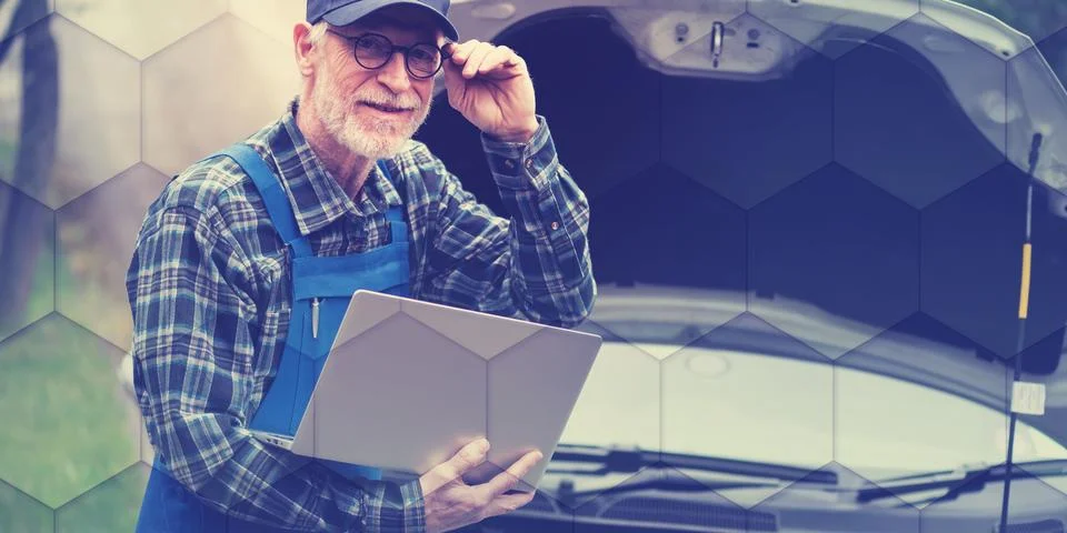 Mechanic using laptop for checking car engine, geometric pattern Stock Photos