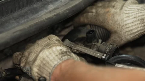 Mechanic using a metal clamp tool on car radiator hose. Stock Footage 341487473