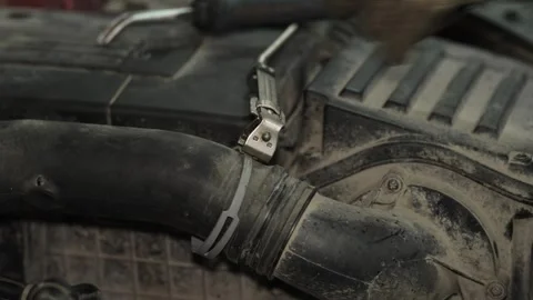 Mechanic using a metal clamp tool on car radiator hose. Stock Footage 341487584