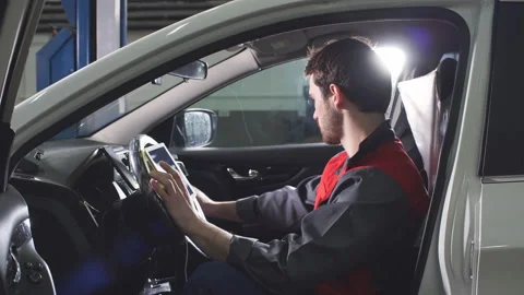 Mechanic Is Using Modern Technologies in the Workshop Stock Footage 89359315