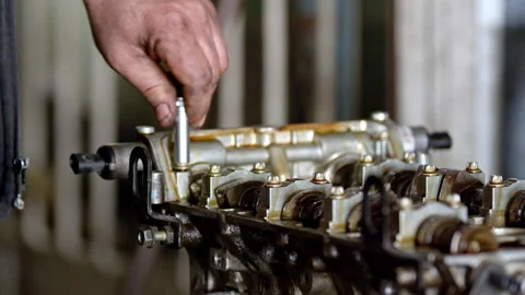 Mechanic using socket wrench on engine Stock Footage 338145474