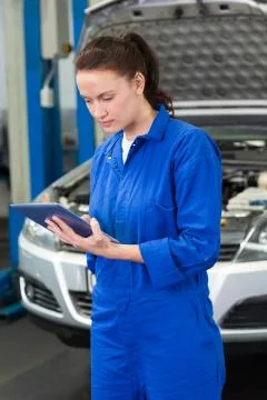 Mechanic using a tablet pc Stock Photos