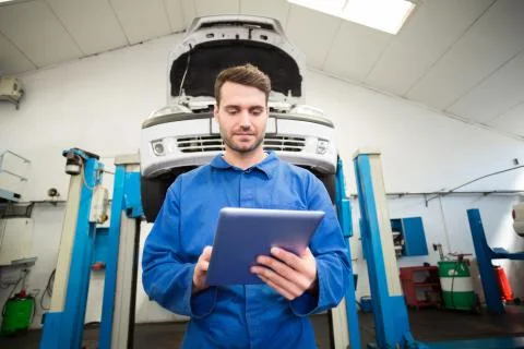 Mechanic using a tablet pc Stock Photos