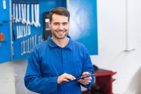 Mechanic using a tablet pc Stock Photos