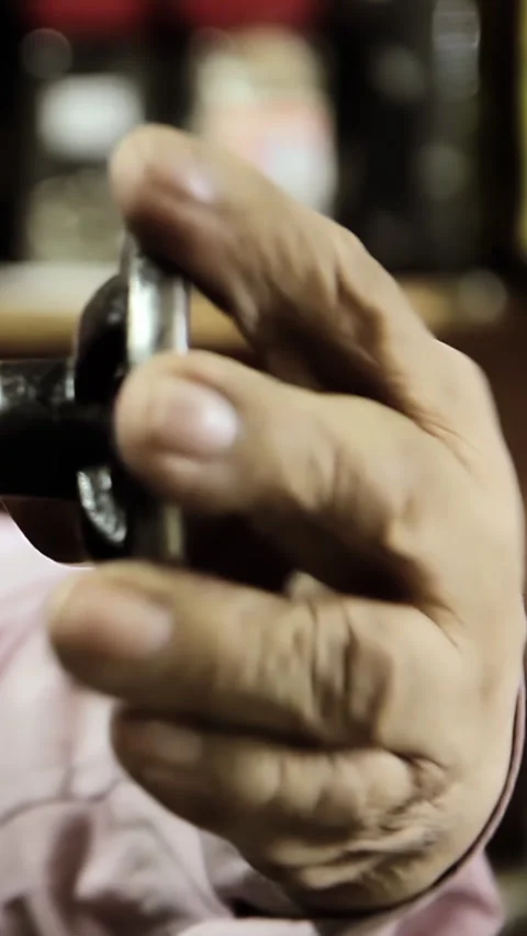 Mechanic Using Vintage Metal Tool to Repair Bike Part in Workshop - Vertical   Stock Footage 332877772