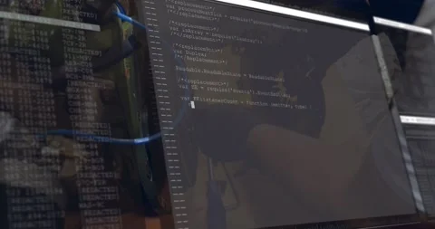 Mechanic at workbench adjusting flywheel while terminal scrolling code, guiding Stock Footage 329910387