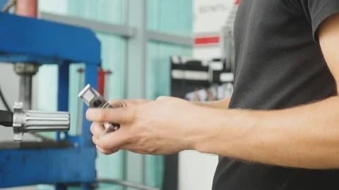 A mechanic working on automotive engine Stock Footage 95626622