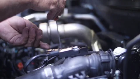 Mechanic working on car engine slow motion Stock Footage