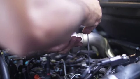 Mechanic working on car engine slow motion Stock Footage